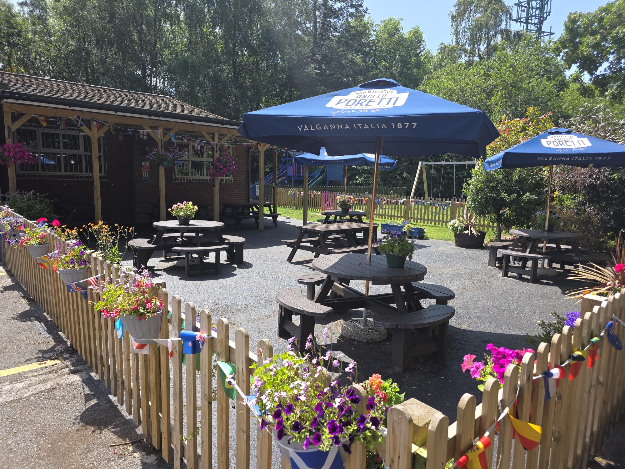 Beer garden with picnic tables and parasols